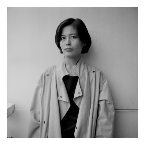 Mrs JungJin Lee, wearing a raincoat. NYC. 1989